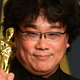 Bong Joon-ho celebrating his wins: Best Original Screenplay, Best Director, International Feature Film, and Best Picture